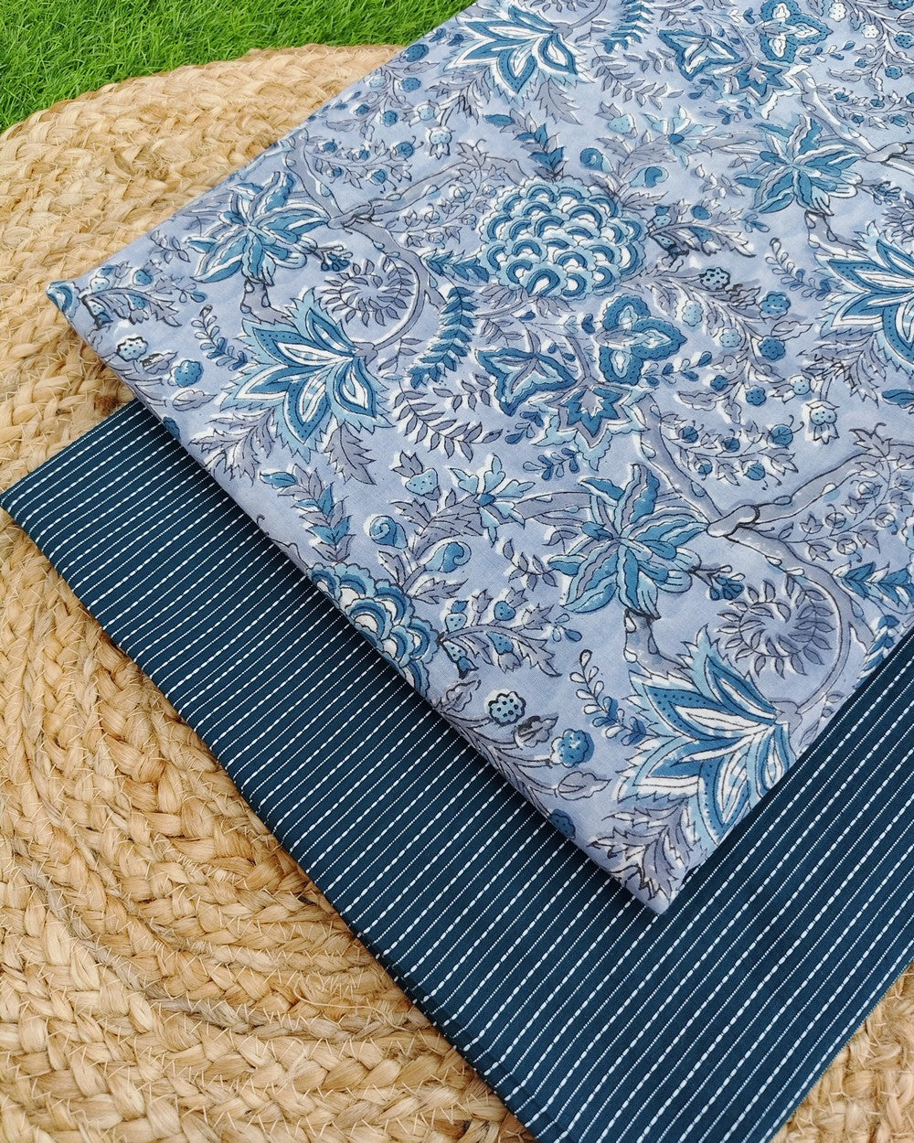 Floral-patterned block printed sanganeri cotton fabric.